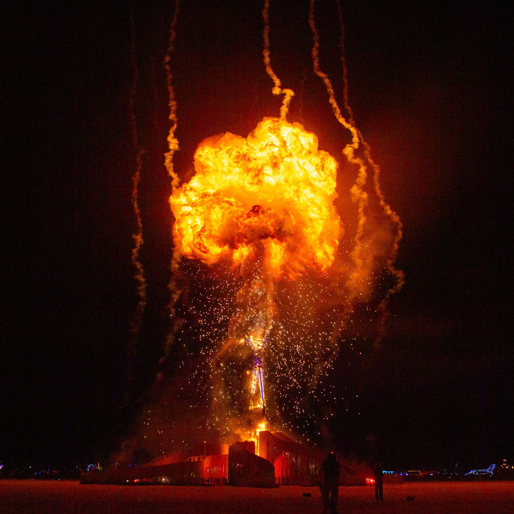 A massive fireball erupting at a night show